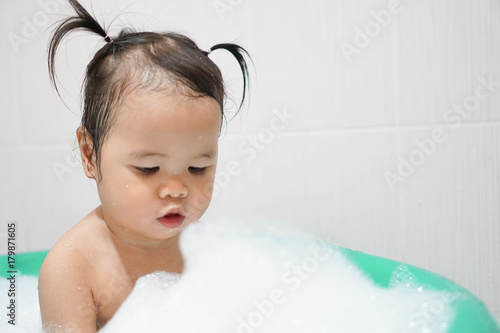 Wallpaper Mural Little asian girl taking bath foam bubbles in bathtub, Toddler 1.8 years old taking bath by herself Torontodigital.ca