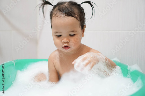 Wallpaper Mural Little asian girl taking bath foam bubbles in bathtub, Toddler 1.8 years old taking bath by herself Torontodigital.ca