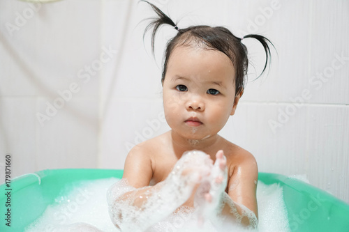 Wallpaper Mural Little asian girl taking bath foam bubbles in bathtub, Toddler 1.8 years old taking bath by herself Torontodigital.ca