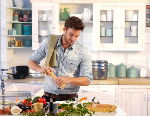 Young man preparing food at home