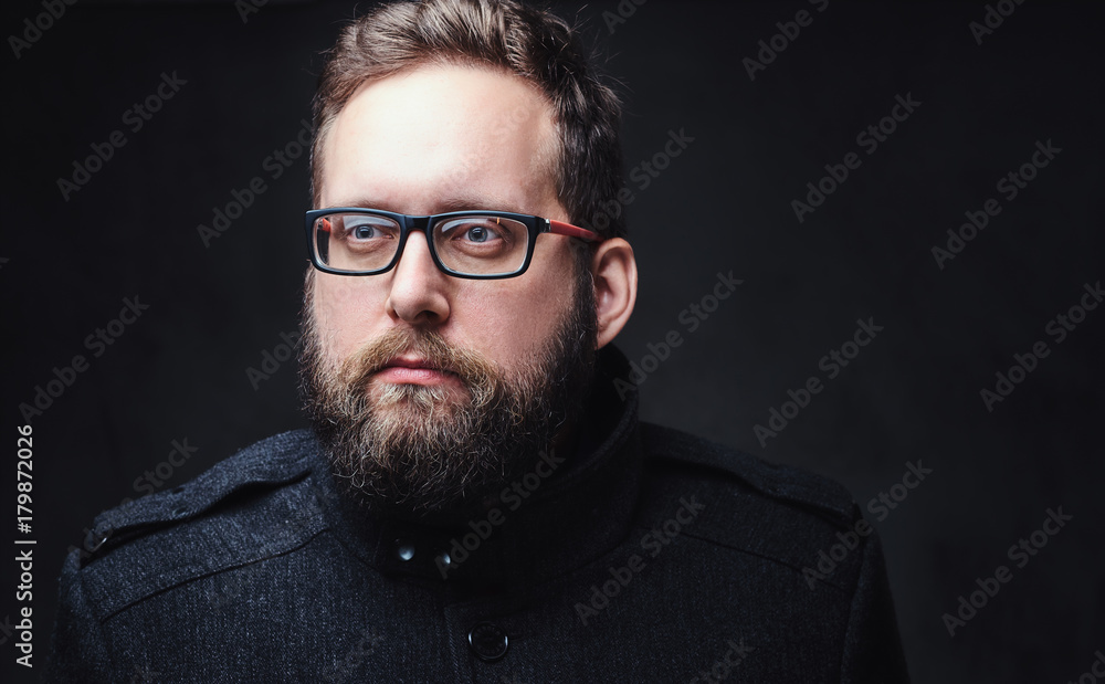 Serious plump male in eyeglasses over grey background. Serious plump male in eyeglasses over grey background.
