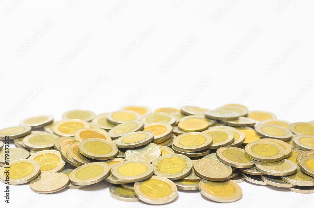 many coins currency Thai Baht lay down on white background. financial and saving concept. many coins currency Thai Baht lay down on white background. financial and saving concept.