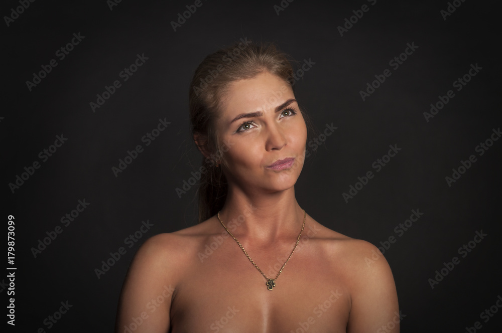 Portrait of emotional girl on a dark background. Portrait of emotional girl on a dark background.