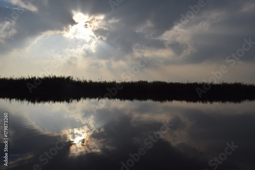 Autumn sun lake reflection landscape in the netherlands