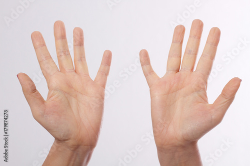Beautiful and healthy woman's hands isolated on white background. Open hands for posting product. Macro human palms. Mock up and copy space. Dermatology. Praying christian arms.