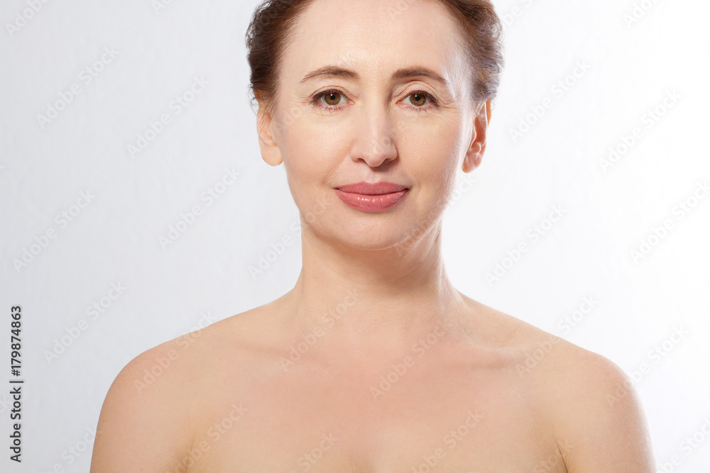 Beauty middle age woman face portrait. Spa and anti aging concept Isolated on white background. Plastic surgery and collagen face injections. Wrinkles and menopause. Mock up. Copy space Beauty middle age woman face portrait. Spa and anti aging concept Isolated on white background. Plastic surgery and collagen face injections. Wrinkles and menopause. Mock up. Copy space