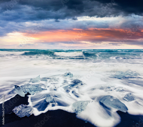 Blocks of ice washed by the waves on Jokulsarlon beach.