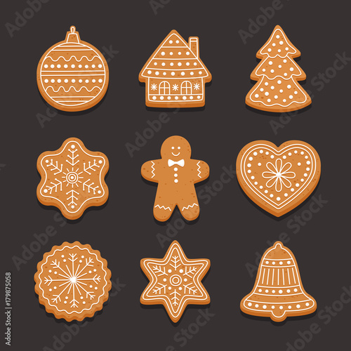 Set Christmas gingerbread: gingerbread house, snowflake, heart, xmas tree and bell on dark background.. Vector illustration.