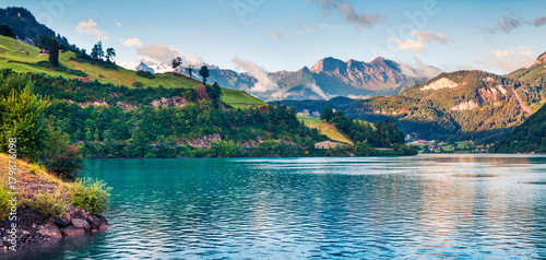 Misty summer panorama of Lungerersee lake. photo