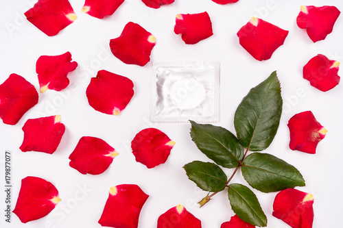 Dear love, roses, special occasions, along with condoms, isolated background. photo