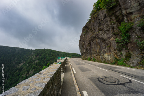 Obraz na płótnie France - Curved street of route de cretes next to massive rocks in mountains of vosges w salonie