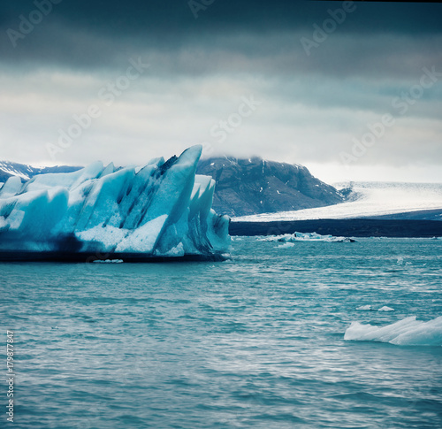 Unbelievable view of floating of blue icebergs in Jokulsarlon glacial lagoon.
