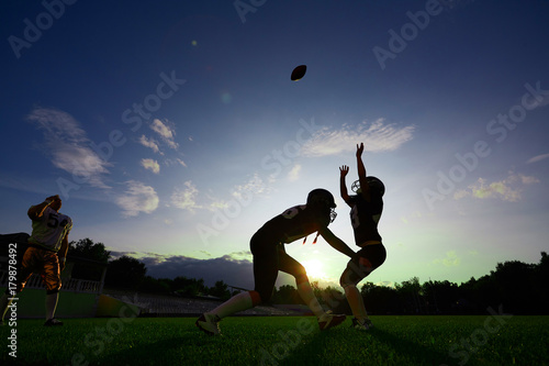 Girls American football player practicing on the field.