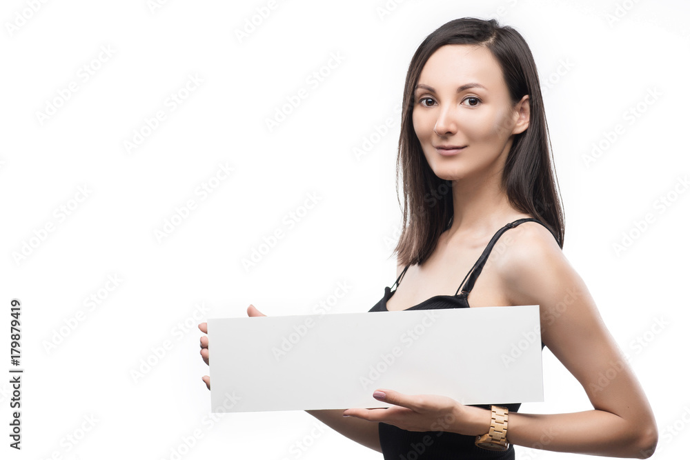 Beautiful girl holds in hand the empty white plate Beautiful girl holds in hand the empty white plate