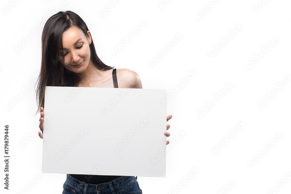 Beautiful girl holds in hand the empty white plate Beautiful girl holds in hand the empty white plate