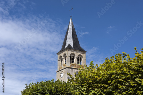 Photo France, Cormatin: Steeple with tower clock, green trees and blue sky