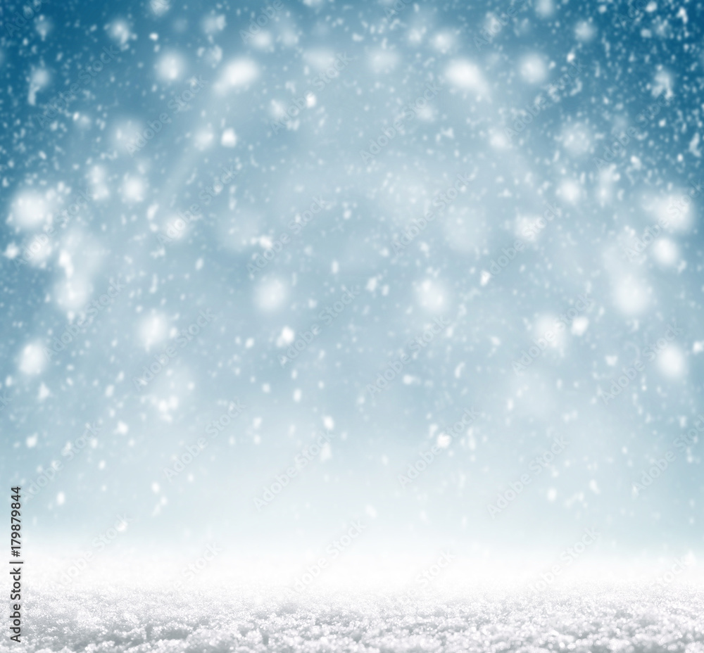 Winter christmas background with shiny snow and blizzard