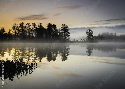 A peaceful beginning to a new day on a secluded lake in the North Woods of northern Wisconsin.