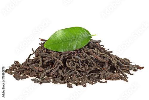 Dry black tea with leaf isolated on a white background
