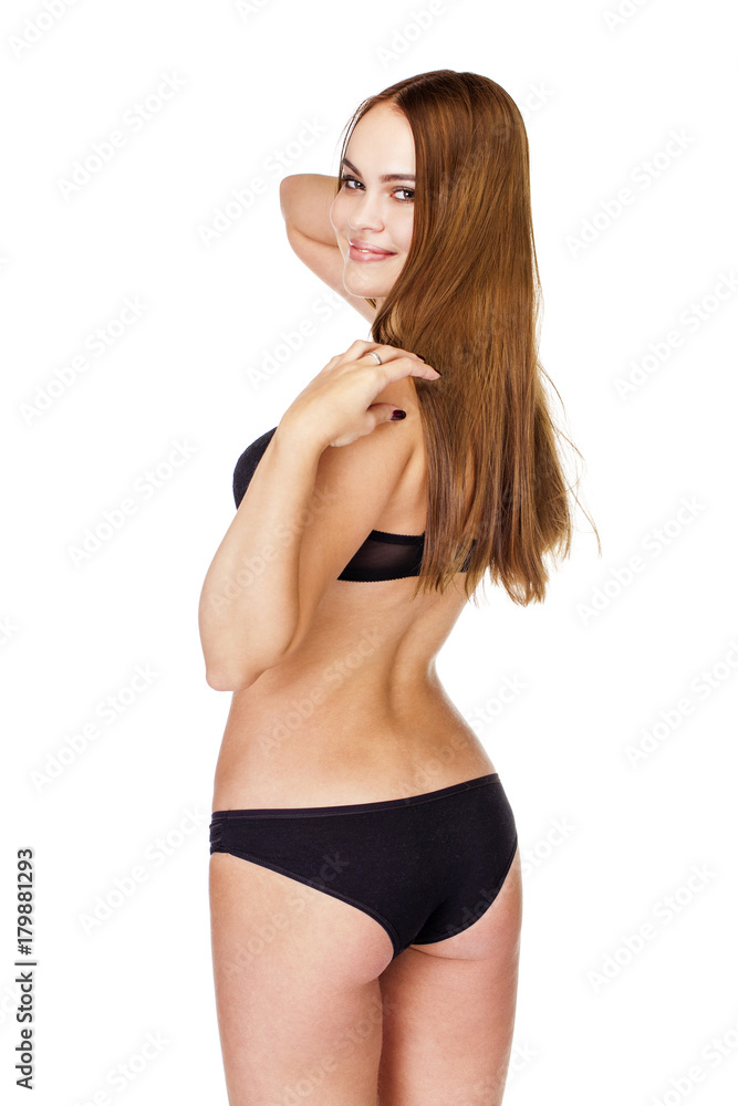 Young brunette woman in black underwear, studio
