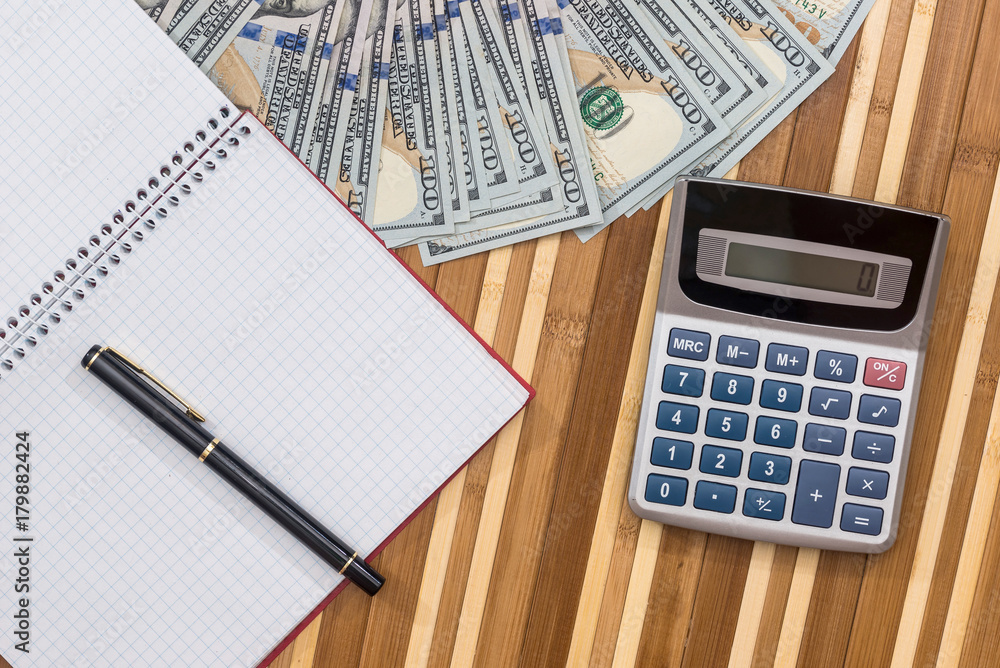 blank notepad with pen, dollar and calculator blank notepad with pen, dollar and calculator
