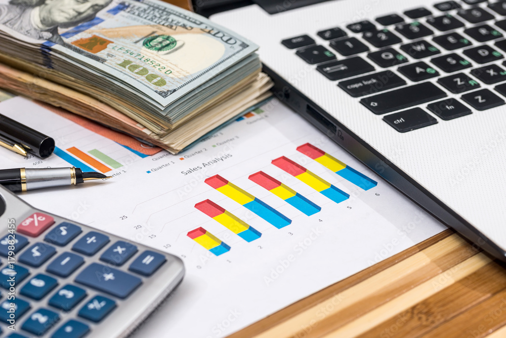 dollar with business graph and laptop dollar with business graph and laptop