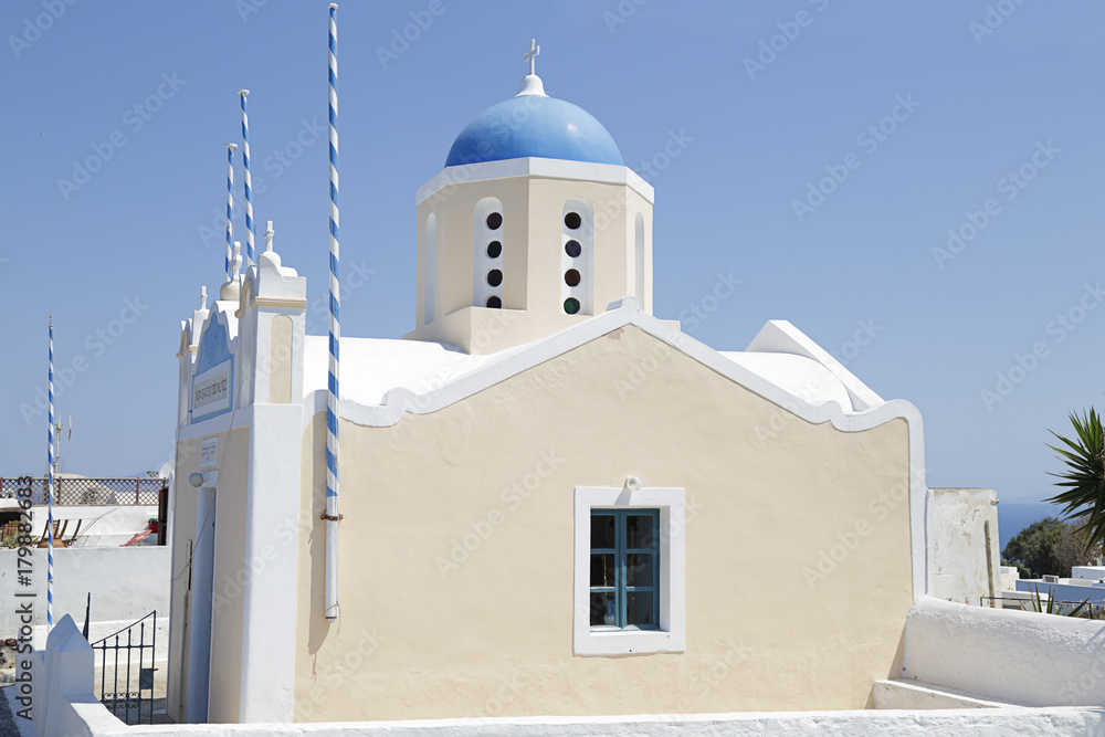 Greek ortodox church with bell tower on Santorini island in Aegean sea, Oia village, Greece