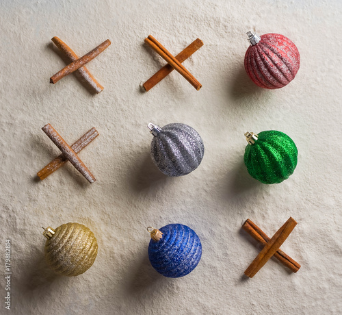 Christmas ornaments and Spices on snow cinnamon Tic Tac Toe holidays, celebrations, fresh, new year, toys, magical photo