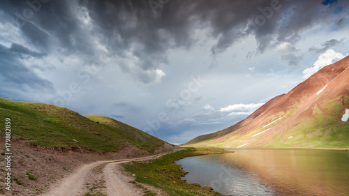 View of Tulpar Kul lake in Kyrgyzstan during the storm photo