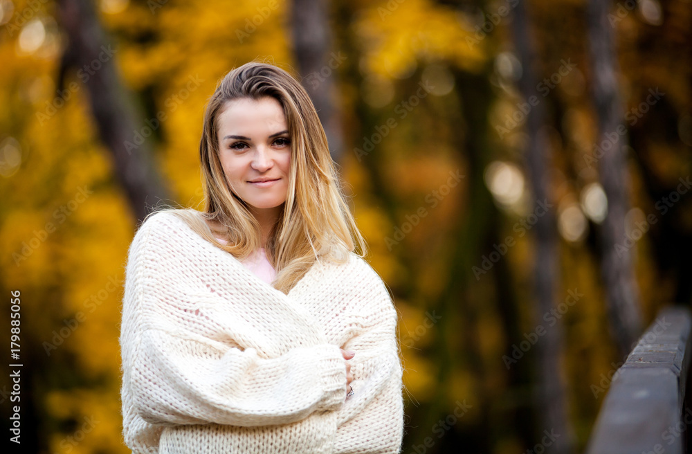 Beautiful young girl in the colorful autumn park Beautiful young girl in the colorful autumn park