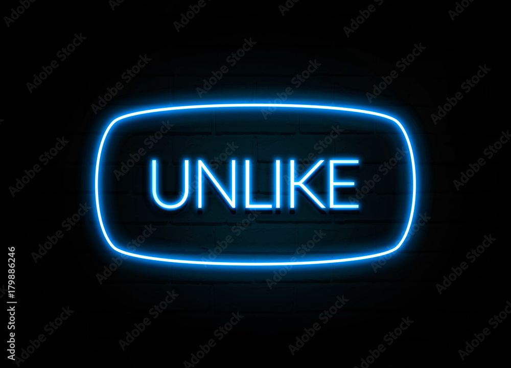 Unlike - colorful Neon Sign on brickwall Unlike - colorful Neon Sign on brickwall
