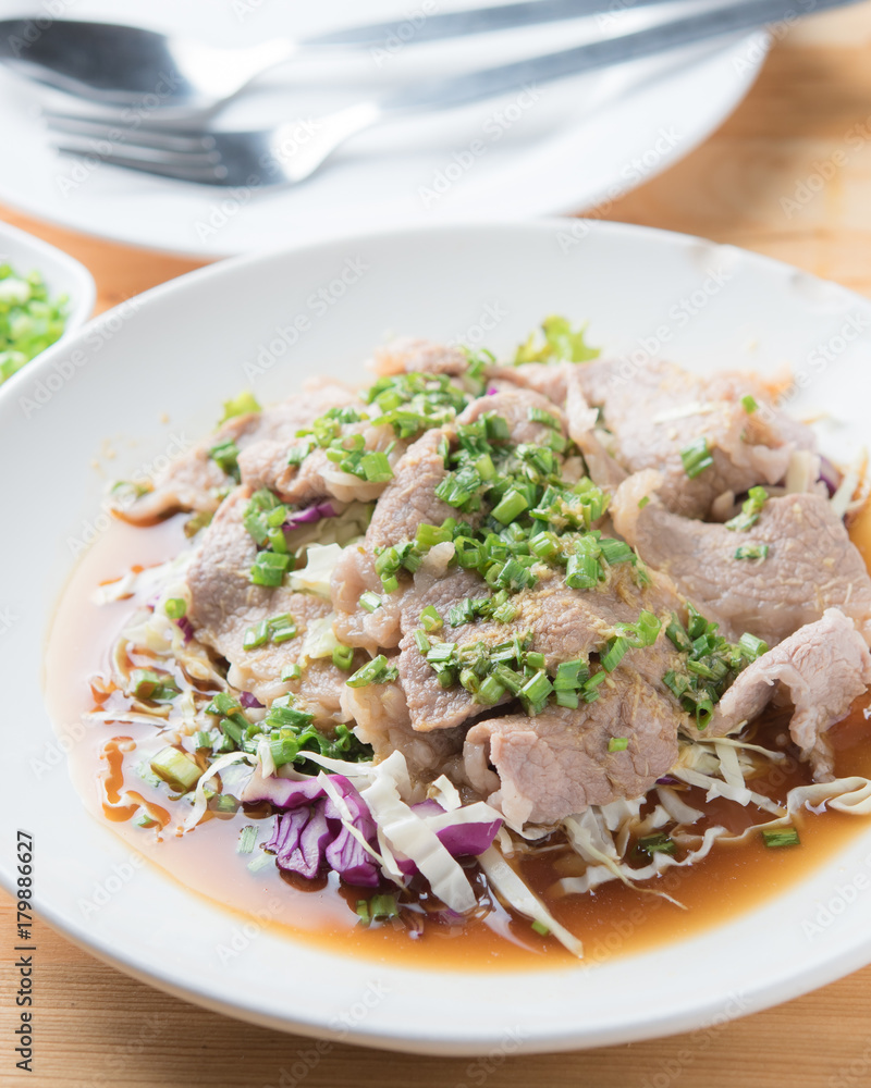 Spicy stir fried pork stips with pepper chilli on wood,thai food Spicy stir fried pork stips with pepper chilli on wood,thai food