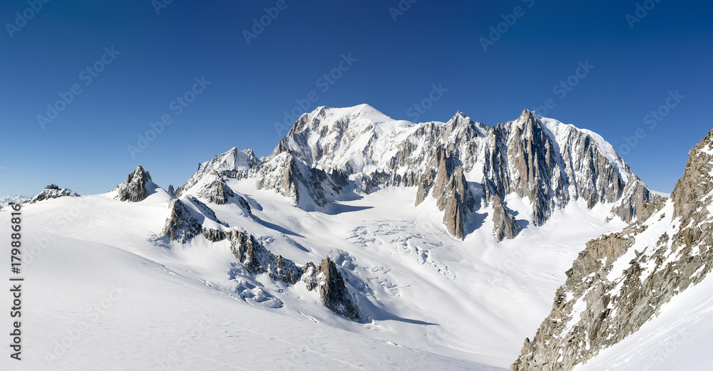 Mont Blanc, east face. Extra-large panorama of Mont Blanc Massif peaks and glaciers in a sunny winter day.