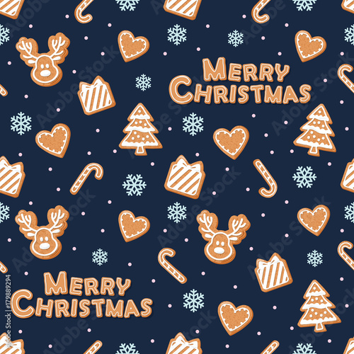 Christmas seamless pattern. Gingerbread cookies and snowflakes on dark blue.