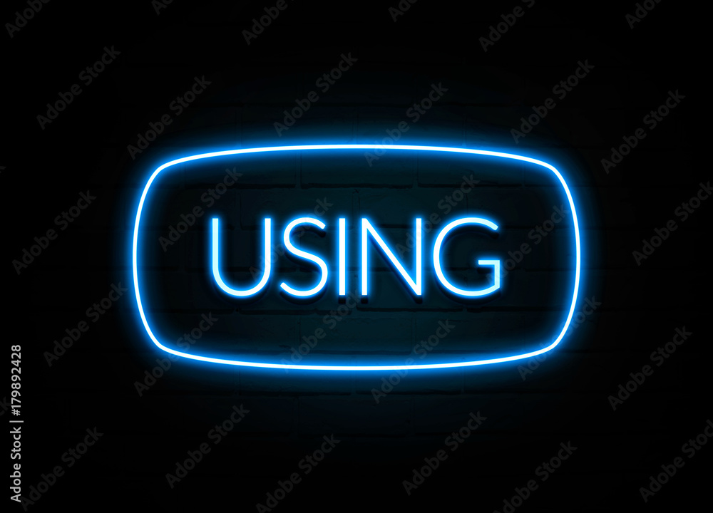 Using - colorful Neon Sign on brickwall Using - colorful Neon Sign on brickwall