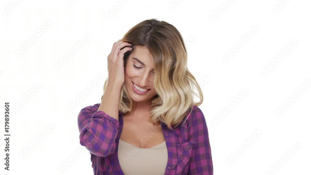portrait of cheerful sexual woman with magnificent look admiring herself face downward touching dyed hair over white background. Concept of emotions portrait of cheerful sexual woman with magnificent look admiring herself face downward touching dyed hair over white background. Concept of emotions