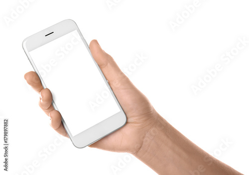 Young woman holding phone on white background
