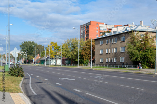 Street of small European town on sunny autumn day, 18 Novembra street, Daugavpils, Latvia