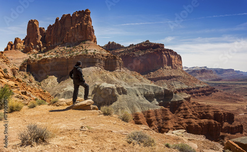 Lone Hiker enjoying Landscape View of Capitol Reef National Park from Chimney Rock Hiking Trail in Utah, United States