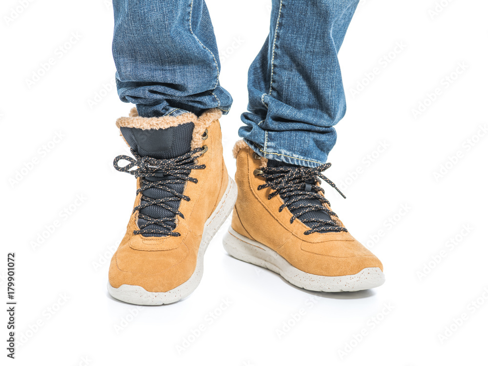 Part of male legs in winter boots Part of male legs in winter boots