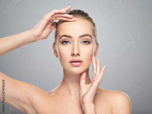 Beautiful face of young woman with perfect skin