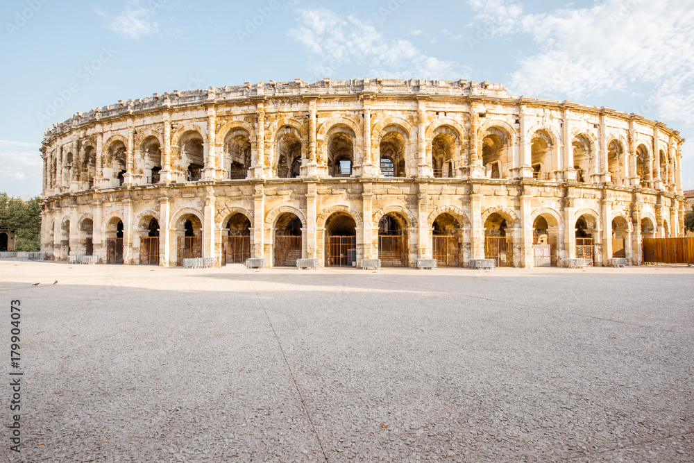 Morning view on the ancient Roman amphitheatre in Nimes city in the Occitanie region of southern France