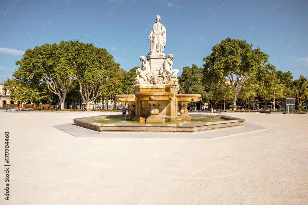 View on the Charles Gaulle fountain in Nimes city during the sunny morning in the Occitanie region of southern France