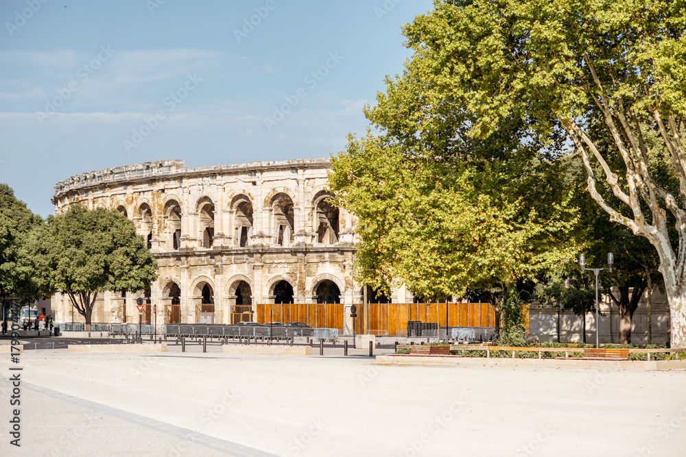Morning view on the ancient Roman amphitheatre in Nimes city in the Occitanie region of southern France