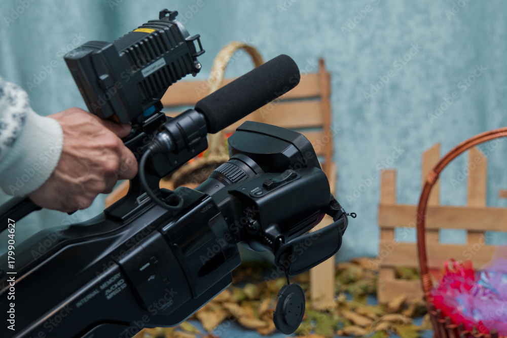 Video camera taking live video streaming at people working background Video camera taking live video streaming at people working background