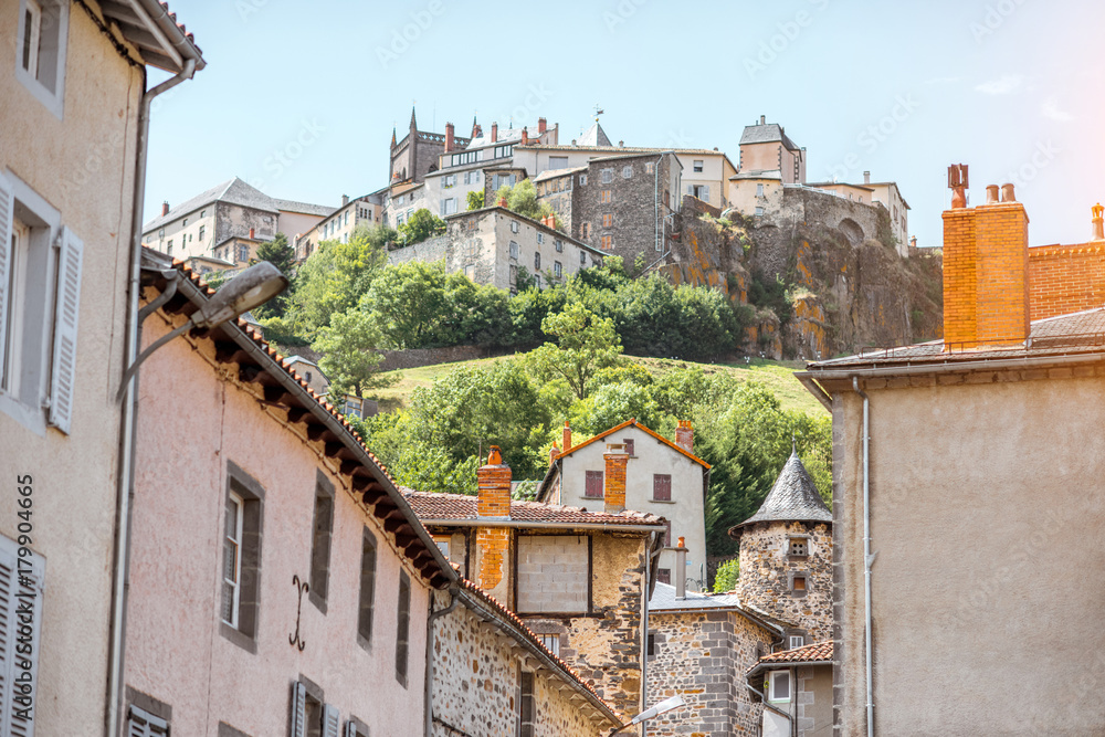 View on the old buildings and hill with fortress in saint Flour village in Auvergne region, France