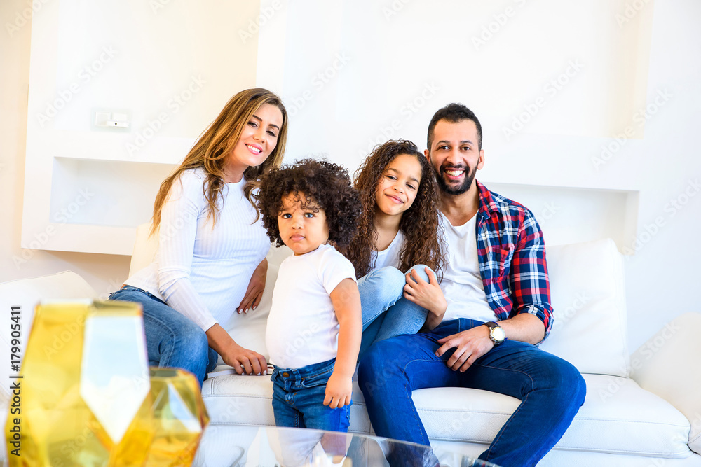 Young family sitting on the couch