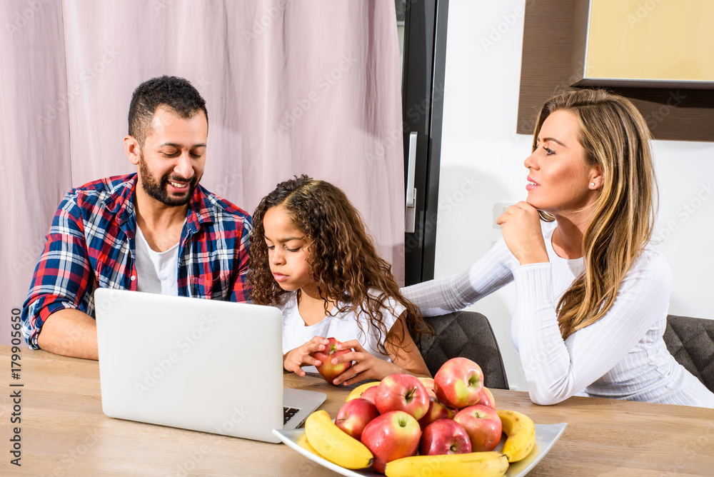 Young family sitting at the table Young family sitting at the table