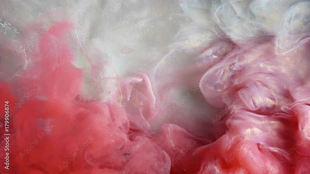 Colorful red/white paint drops from above mixing in water. Ink swirling underwater. Cloud of ink isolated. Colored abstract smoke explosion animation. Close up view Colorful red/white paint drops from above mixing in water. Ink swirling underwater. Cloud of ink isolated. Colored abstract smoke explosion animation. Close up view
