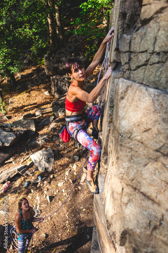 girl climber on a rock.